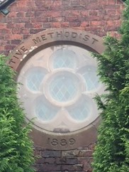 Main window above main entrance. Main window above main entrance. | Rev. David Leese