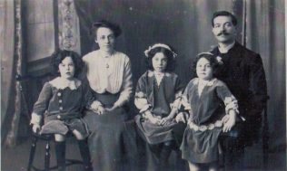 Picture taken circa 1915. From left to right as viewed the children are Eric Howard, then Mavis Freda, and finally Zoe Katherine (sitting with her father) | Hampshire Record Office: 58M75/NMC68 through Noel Clark