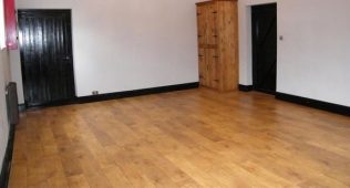 The vaulted ceiling is not shown in this picture of our now lounge pre-December 2015. The front former chapel door is on the left and near the red cupboard housing the electric meter. The door on the right is entered via our linked cottage through a small conservatory type porch, part of the year 2000 planning granted. The vaulted ceiling is not shown in this picture of our now lounge pre-December 2015. The front former chapel door is on the left and near the red cupboard housing the electric meter. The door on the right is entered via our linked cottage through a small conservatory type porch, part of the year 2000 planning granted. | Ray & Marie