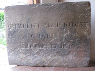 The plaque above is from the 1819 chapel