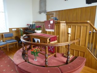 Communion table, plush runner and pulpit cover given by Samuel and Elizabeth Forrester in 1928 | Dianne Gibson