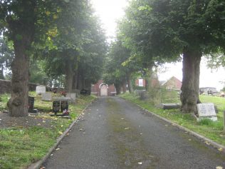Driveway up through graveyard to chapel building Driveway up through graveyard to chapel building
